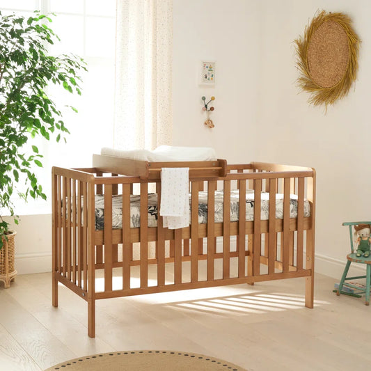 Malmo 3-in-1 Convertible Cot Bed in Oak. Includes Mattress and Cot Changing Topper.